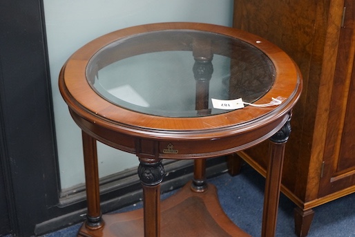 A pair of Empire style circular mahogany glass top occasional tables, larger diameter 60cm, height 61cm